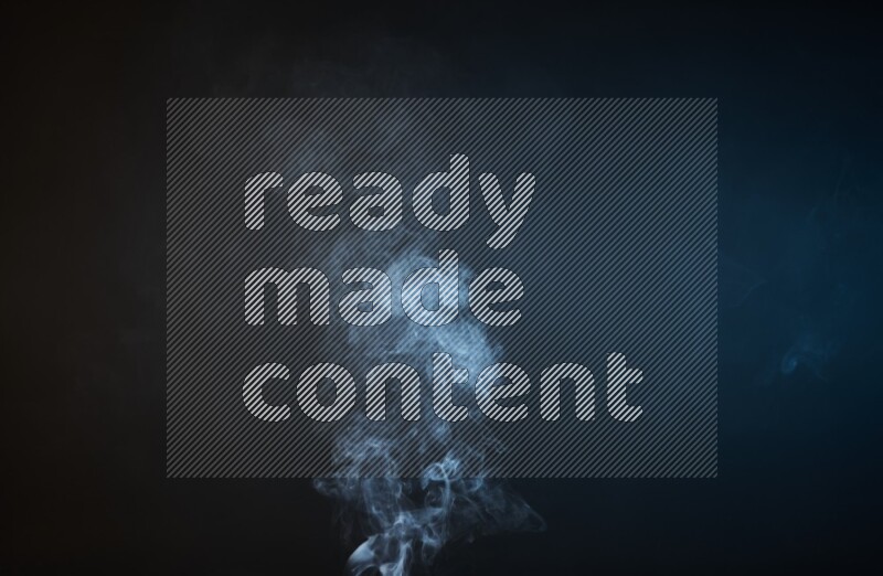 Heavy smoke in blue and yellow isolated on black background