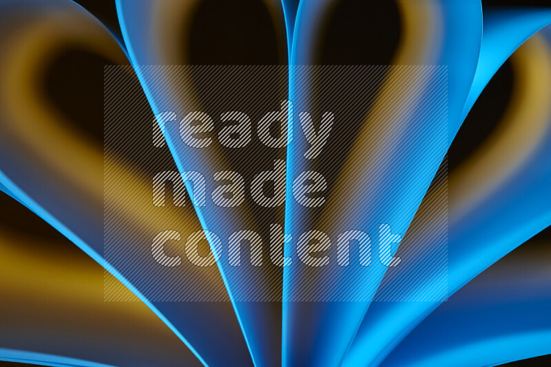 فن تجريدي يعرض منحنيات وتدرجات اللون الأصفر والأزرق مكونه بضوء ملون