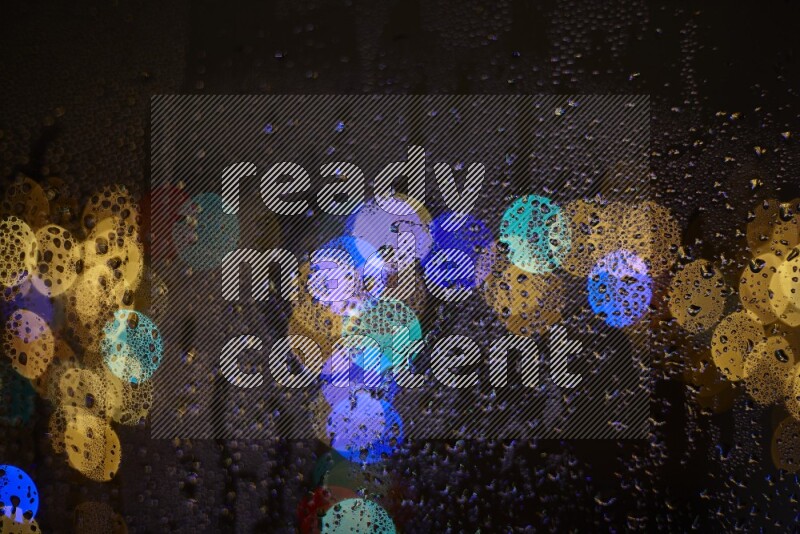 Bokeh light in multicolor with water drops