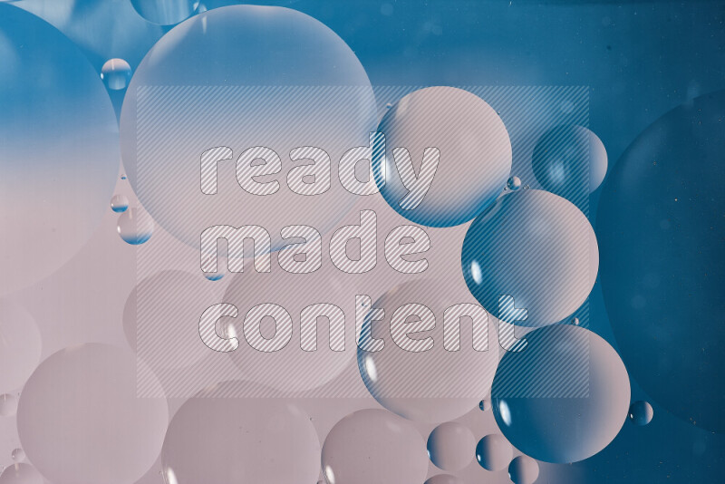 Close-ups of abstract oil bubbles on water surface in shades of white and blue