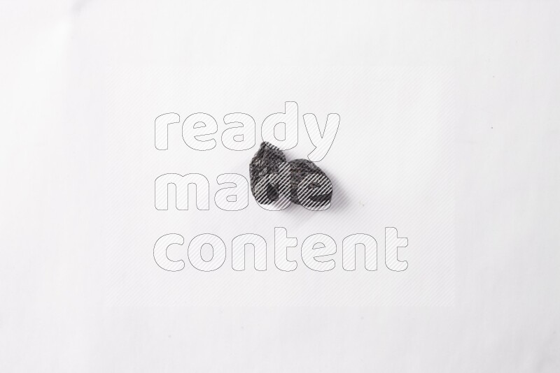 Dried plums on white background
