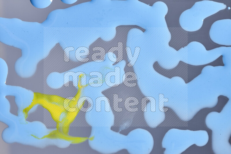 Abstract colorful background with mixed of yellow and blue paint colors