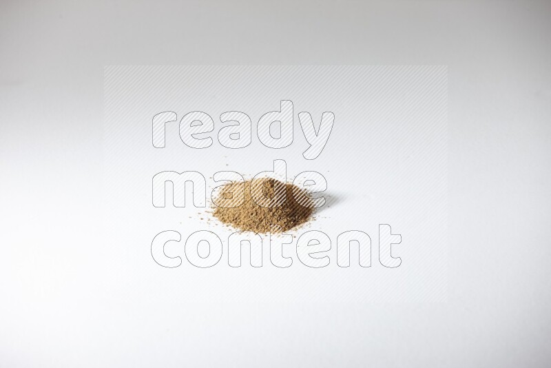 Cumin powder on white flooring