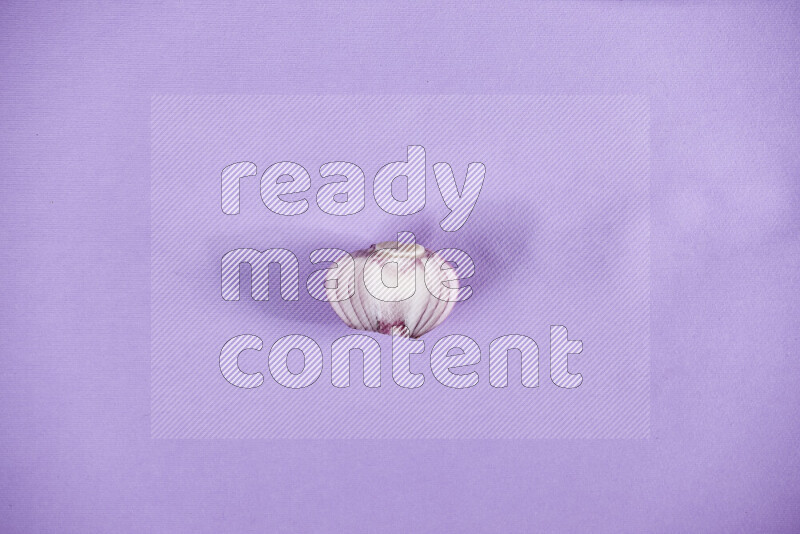 Halves red onions on a purple background