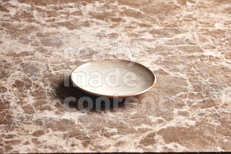 Beige Pottery Plate on Beige Marble Flooring, 45 degrees