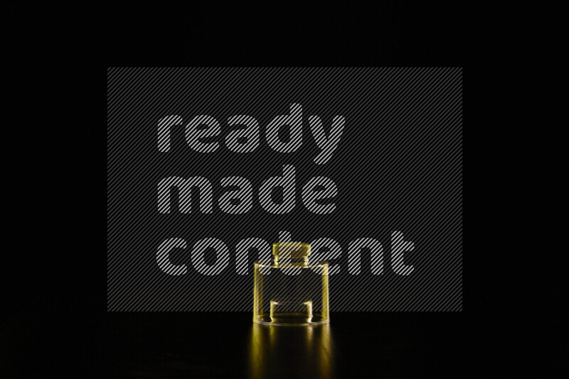 Glassware with rim light in yellow against black background