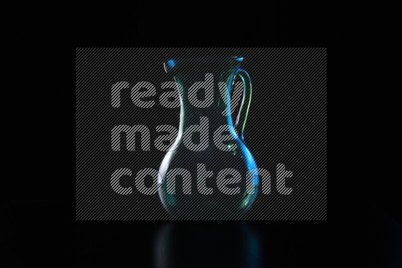 Glassware with rim light in blue and white against black background