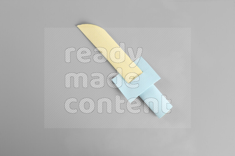 Origami sword on grey background