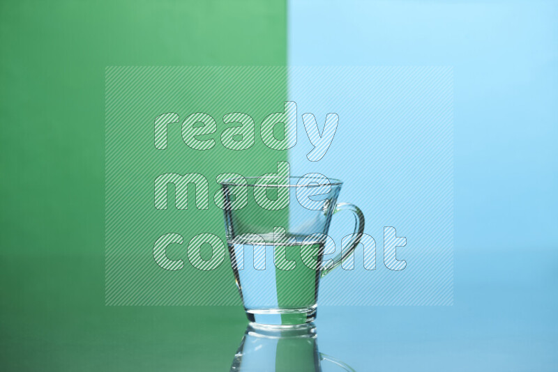 The image features a clear glassware filled with water, set against green and light blue background