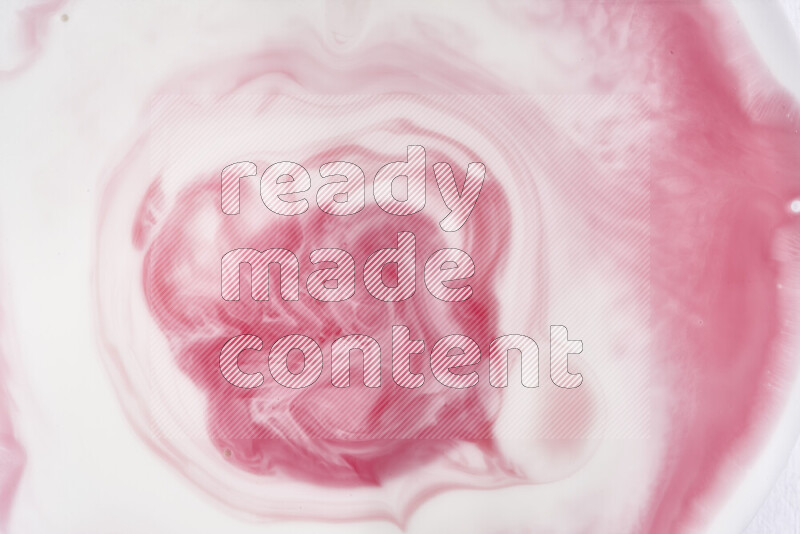 A close-up of abstract swirling patterns in red and white