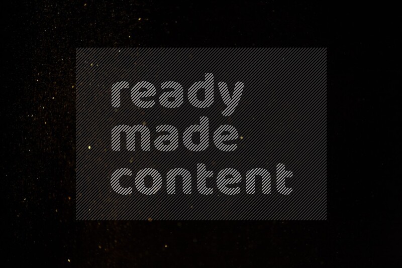 Gold glitter powder isolated on black background