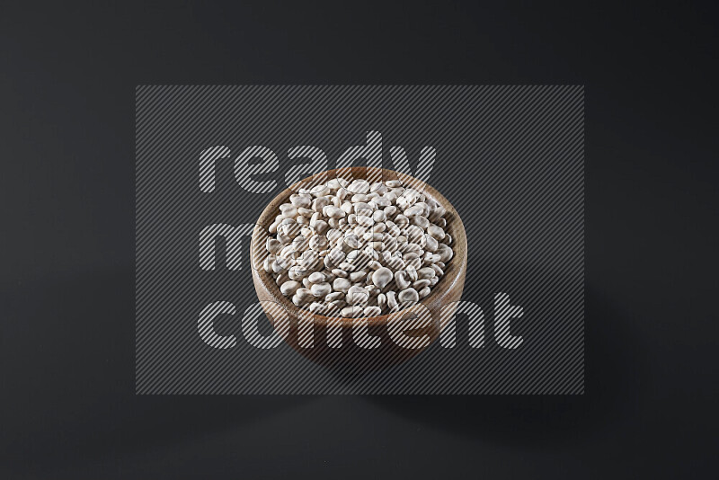 Lupin Beans in a wooden bowl on grey background