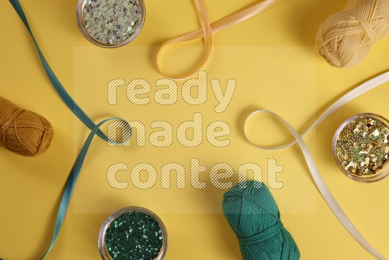 A green collection of sewing and tailoring tools arranged on a yellow background