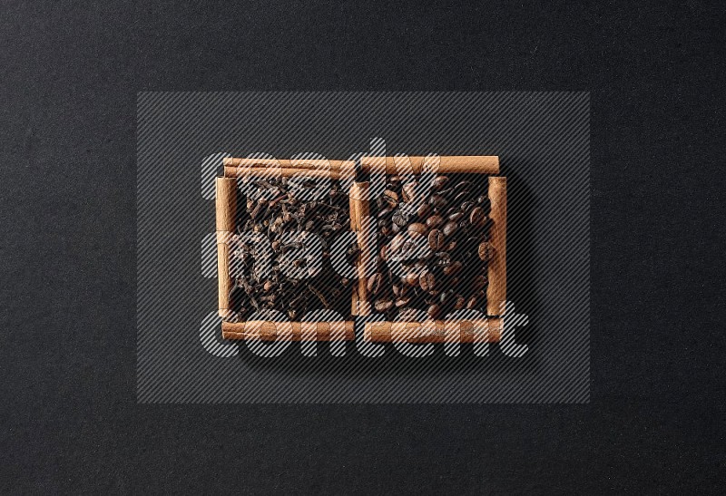 2 squares of cinnamon sticks full of coffee beans and cloves on black flooring