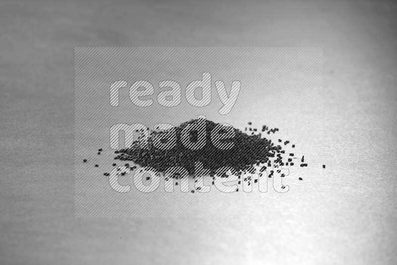 Black seeds on a black flooring