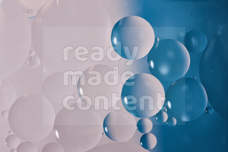 Close-ups of abstract oil bubbles on water surface in shades of white and blue