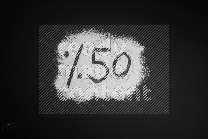 Percentages written with powder on black background