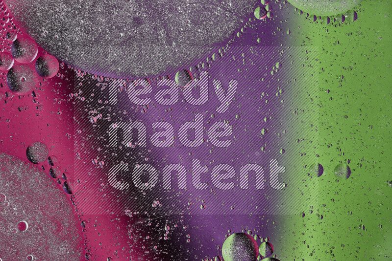 Close-ups of abstract oil bubbles on water surface in shades of purple, green and pink