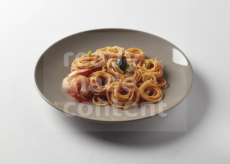 spaghetti pasta with red sauce on a grey plate on a white background