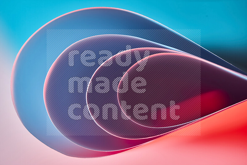 An abstract art of paper folded into smooth curves in blue and red gradients