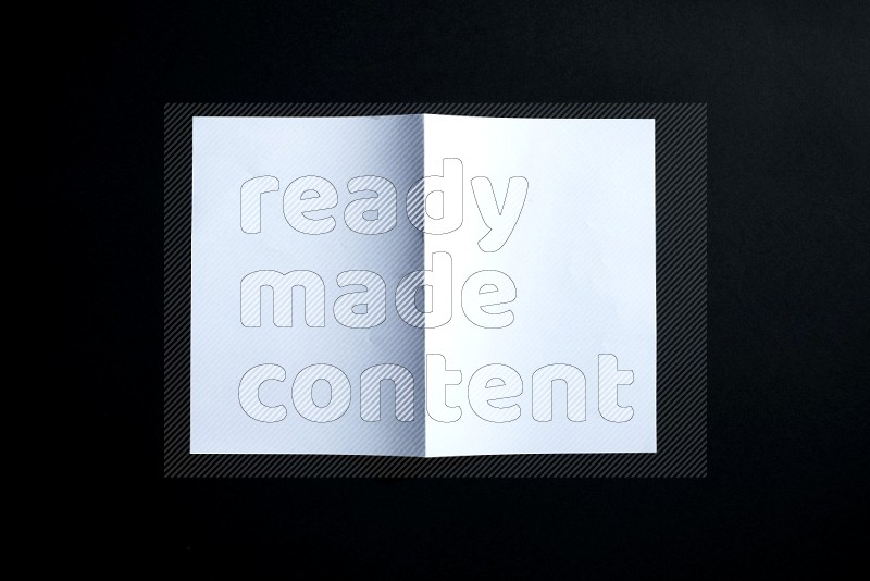 White paper sheet on black background