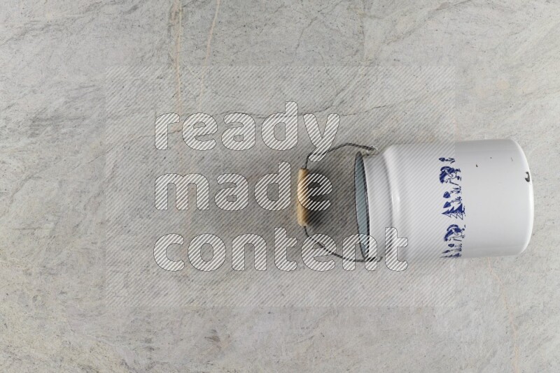 A vintage milk can on grey marble background