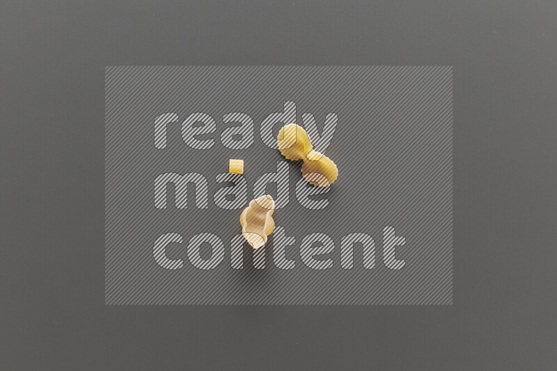 Different pasta types on grey background