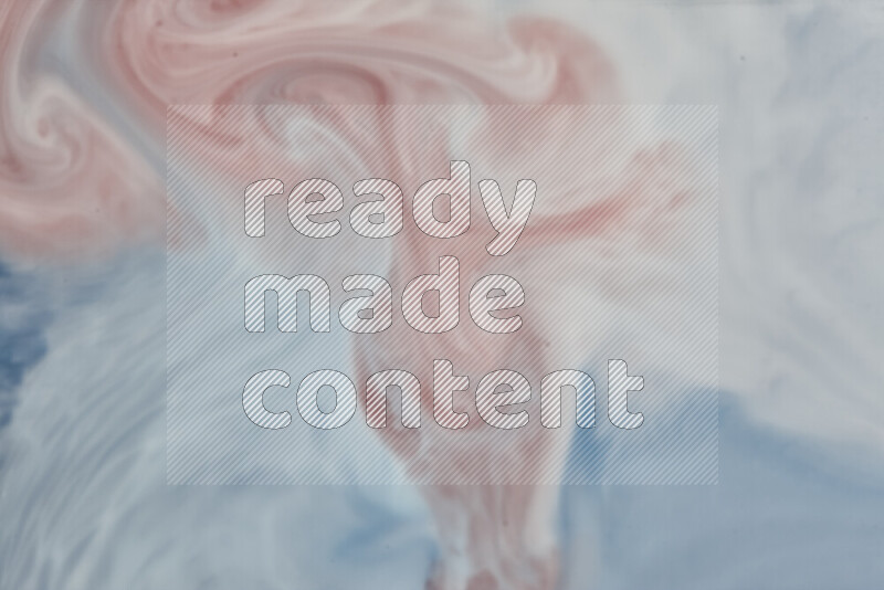 A close-up of abstract swirling patterns in blue, red and white