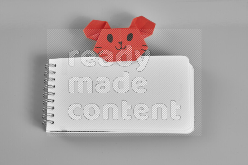 Origami animals on grey background