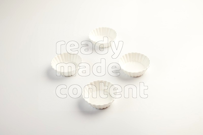 white ceramic round sauce dish on white countertop