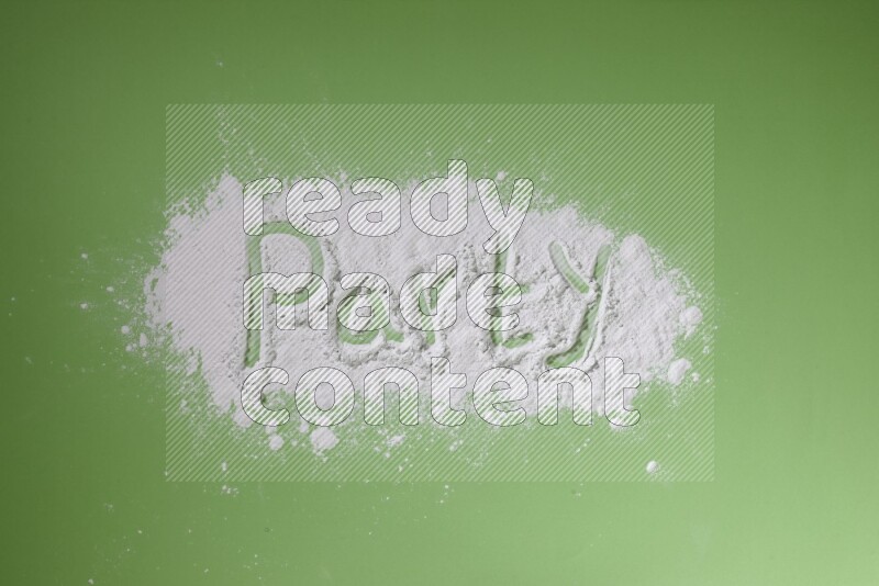 A word written with powder on green background