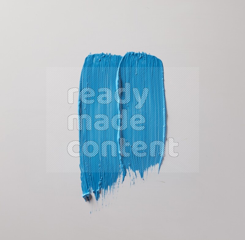 Multi blue straight brush strokes in different shapes on a white background