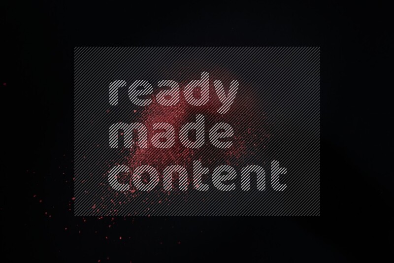 Red powder explosion on black background