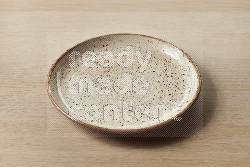 Beige Pottery Plate on Oak Wooden Flooring, 45 degrees