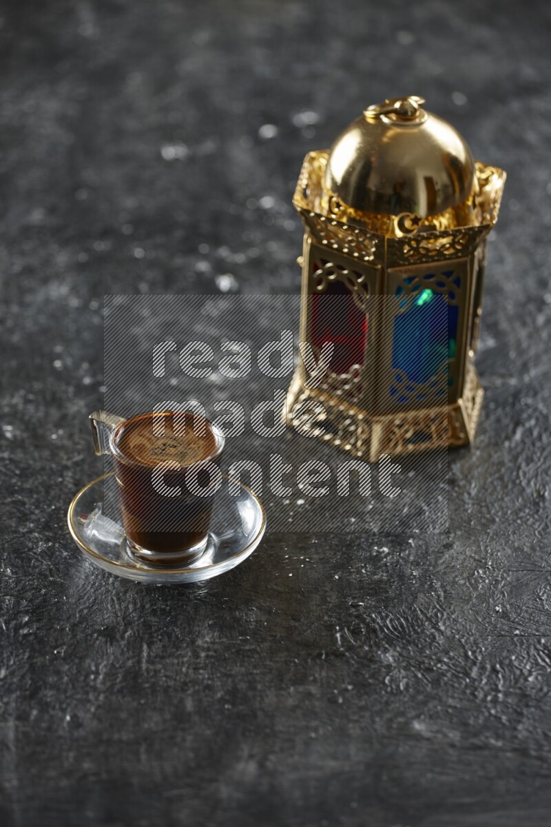 A golden lantern with different drinks, dates, nuts, prayer beads and quran on textured black background