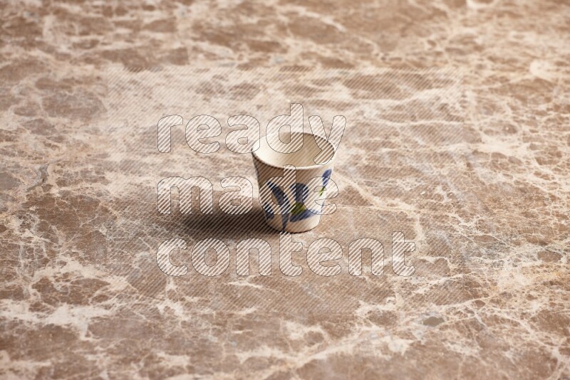 Pottery Cup on Beige Marble Flooring