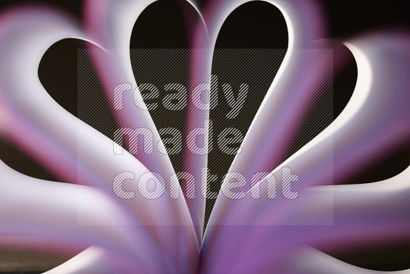 An abstract art piece displaying smooth curves in white and purple gradients created by colored light