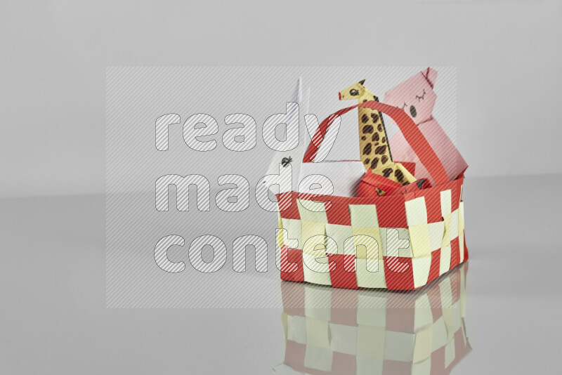 Origami animals on grey background