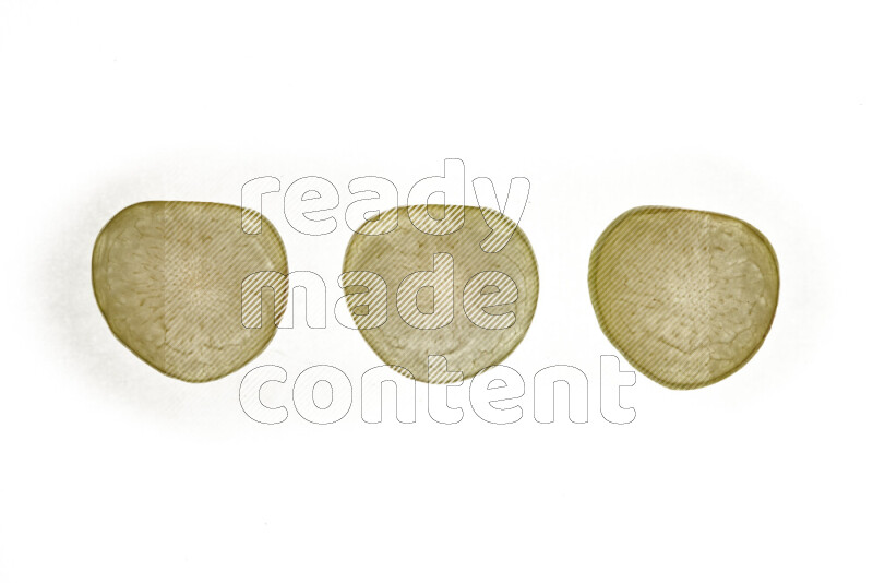 Plum slices on illuminated white background