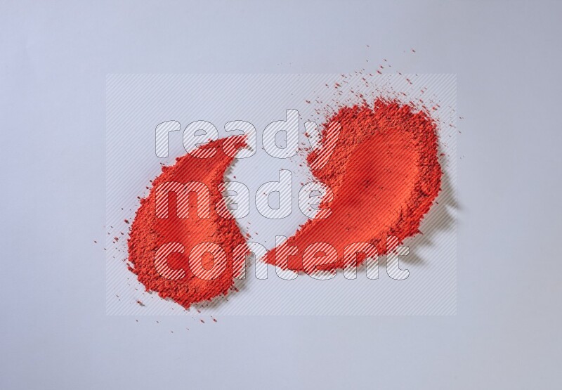 Red powder strokes on white background