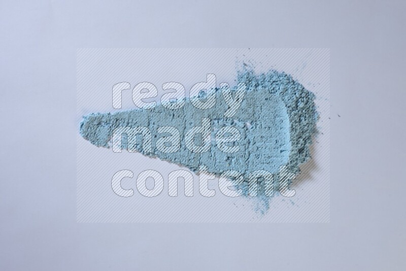 Blue powder strokes on white background