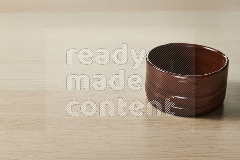 Brown Pottery Bowl on Oak Wooden Flooring, 15 degrees