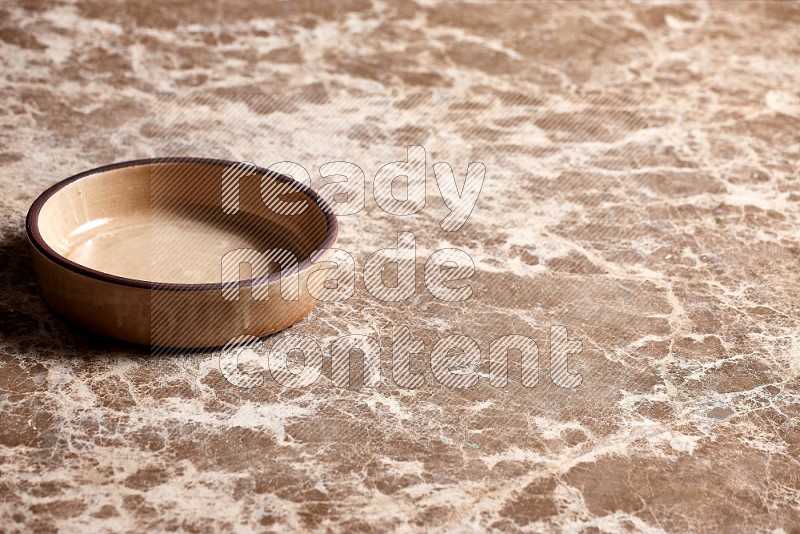 Beige Pottery Oven Plate on Beige Marble Flooring, 45 degrees