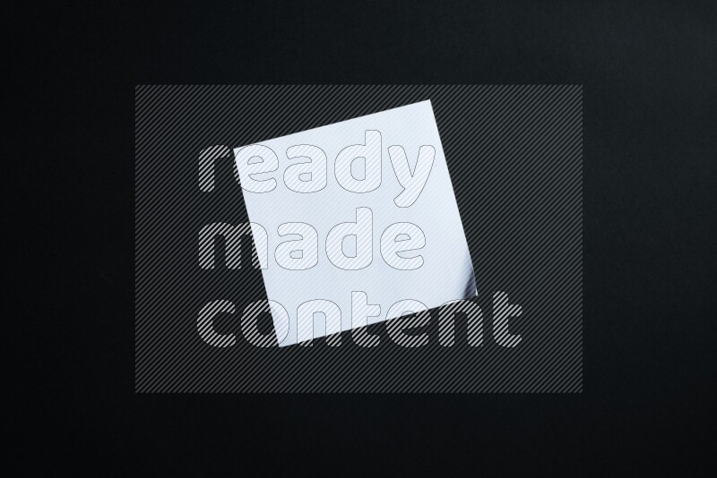 White paper sheet on black background