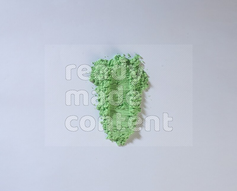 Green powder strokes on white background