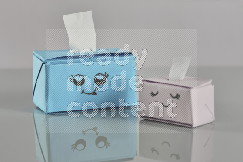 Origami tissue box on grey background