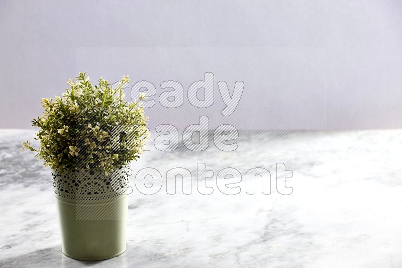 Artificial Thyme Plant in Light Green Decorative Pot on Light Grey Marble Background 45 degree angle
