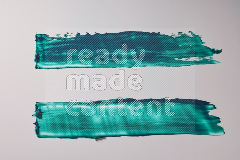 Turquoise painting knife strokes on white background