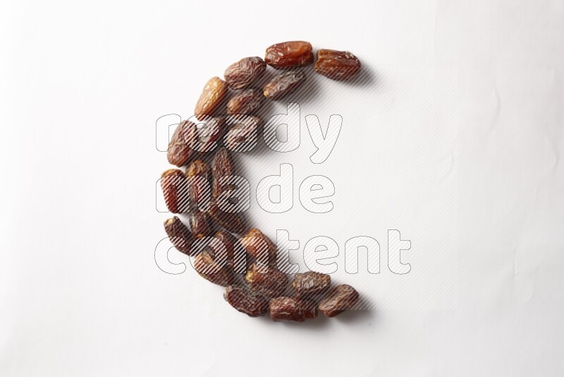 Dates in a crescent shape on white background