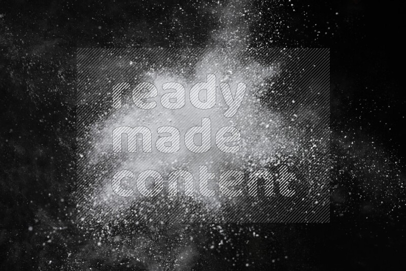 White powder explosion on black background